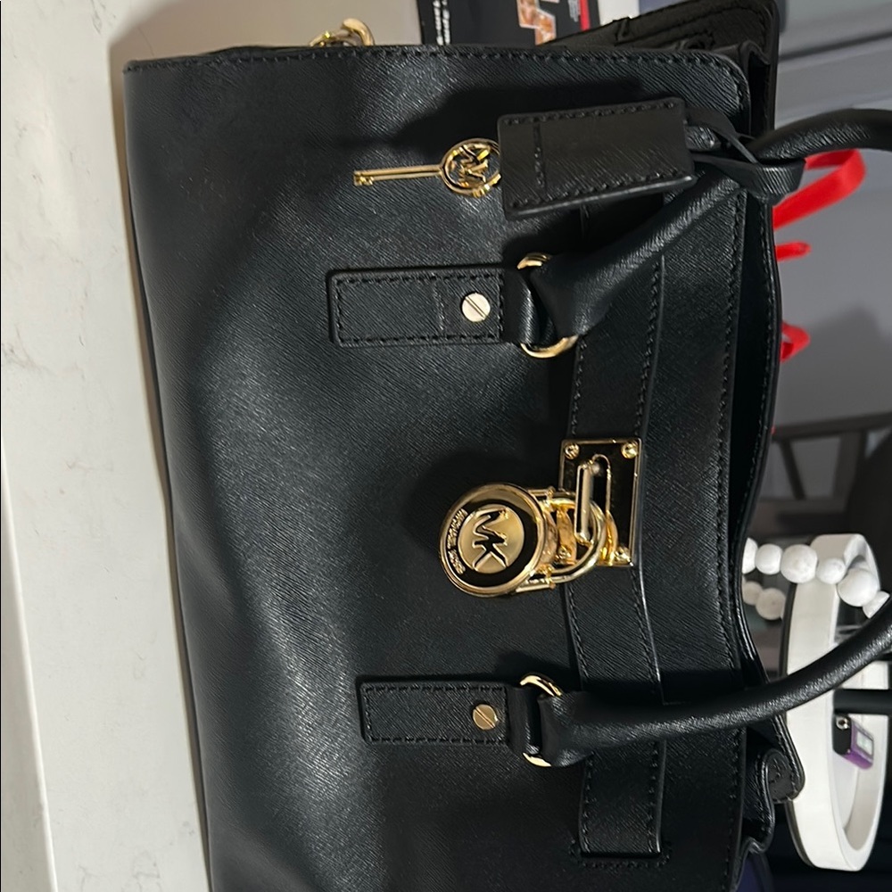Michael Kors Black and Gold Satchel with Structured Design